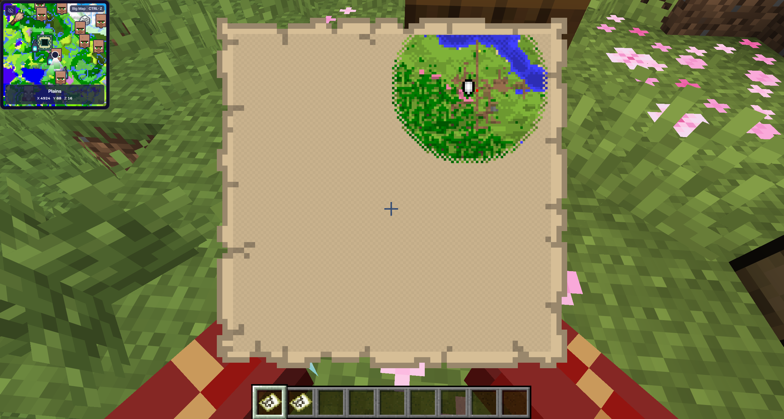 A large explored map held in Minecraft with the MineyMap minimap visible