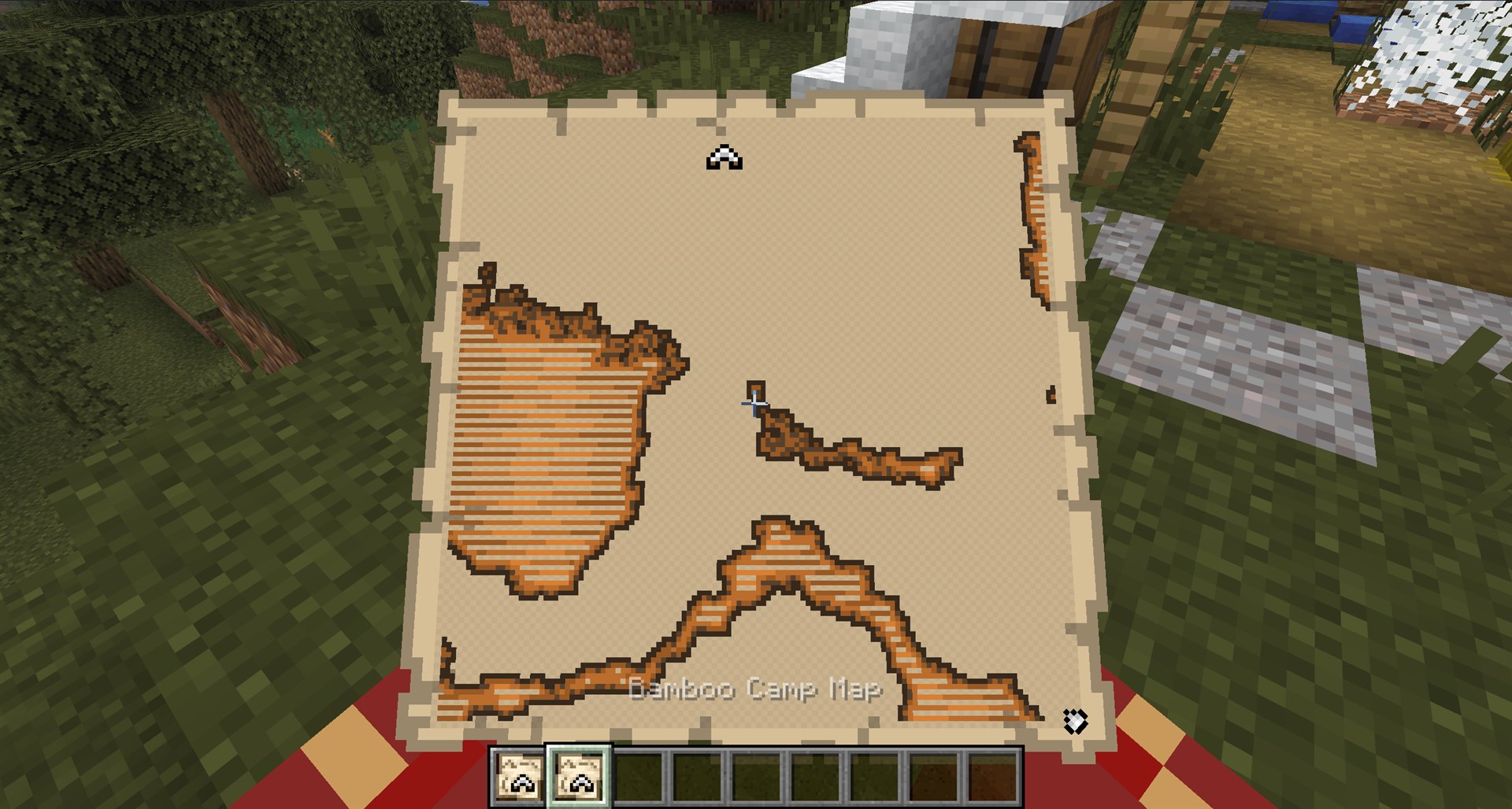 A Bamboo Camp Map held in Minecraft with its destination marker visible